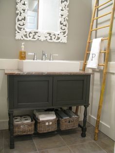 a bathroom with a ladder and sink in it