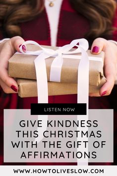 a woman holding a wrapped present with the words, give kindness this christmas with the gift of affirmations