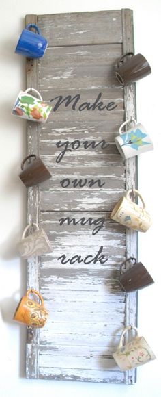 an old door is decorated with tea cups and saying make your own mugs rack