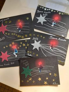 four handmade greeting cards with stars on them