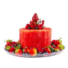 a strawberry cake with berries and blueberries on the top is surrounded by other fruit