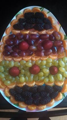 a plate filled with fruit on top of a table