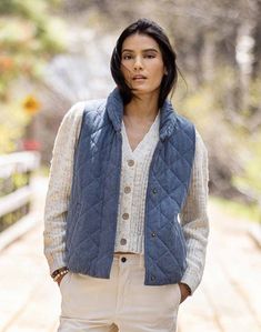 A Bay Area staple, this puffer vest features a lightweight yet insulating quilted material and cozy collar — a great pick for after hot yoga, when you just need a little extra warmth. You can also layer this vest with a turtleneck or your favorite long sleeve tee for a more refined look. Casual Quilted Cotton Vest, Fall Cotton Quilted Vest, Quilted Fitted Vest For Fall, Fall Quilted Cotton Vest, Quilted Vest For Layering In Fall, Fitted Quilted Vest For Fall, Versatile Fitted Winter Vest, Versatile Fitted Vest For Winter, Cable Knit Cotton Outerwear For Cold Weather