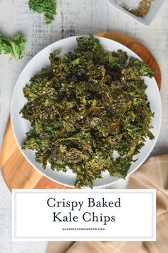 crispy baked kale chips on a white plate