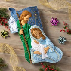 the nativity scene is made out of felt and decorated with christmas decorations, such as starbursts