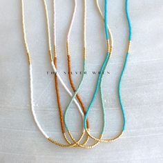 Seed Bead Necklaces for Women, perfect to layer or a fun piece of dainty jewelry to add a little splash of color!  D E T A I L S *Seed beads in your choice of color combination  *Hand strung in a modern pattern *14kt Gold-Filled beads & spring clasp Color combos:  white & beige  rust & blush  seafoam & beige  turquoise & turquoise  LENGTH *16 inches in length or 16 inches with a 2 inch extender  *Choose a 18 inch length or a 18 inch with a 2 inch extender for up to 20 inches. HOW TO PERSONALIZE *Select your choices from the drop down menu to create your custom design. ∙ EXTRA LOVE ∙ Handcrafted just for you in sunny Arizona by a team of talented women. All of our jewelry comes gift packaged! We are happy to leave a note if this is a special gift, just let us know in the message box at chec Seed Bead Necklaces, Seed Bead Jewelry Patterns, Bead Necklaces, Layer Necklace, Gem Necklace, Message Box, Seed Bead Necklace, Necklaces For Women, Seed Bead Jewelry