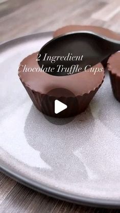 two chocolate truffle cups on a plate with the words, ingredient chocolate truffle cups