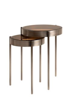 two round tables with metal legs and wood top, one on the other end table