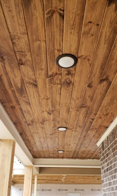 a ceiling with wood planks and a light fixture