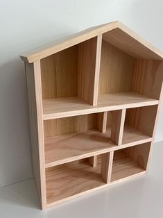 a wooden shelf with several shelves in it