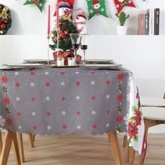 the table is decorated with christmas decorations