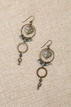 From the Czech Glass collection these charming moon earrings are handcrafted with intricate designs and delicate colors and are sure to add a touch of whimsy and elegance to any outfit Antique Brass (lead and nickel free) Czech Glass 3", with antique plated brass ear wires We hand select our natural materials, thus there may be slight variations in color and/or size that will not detract from the overall aesthetic Our unique handcrafted designer jewelry for women is made in America, each design Bohemian Brass Earrings With Moon Charm, Bohemian Moon-shaped Bronze Jewelry, Nickel-free Brass Chandelier Earrings, Nickel-free Bohemian Pewter Jewelry, Vintage Moon-shaped Metal Earrings, Handmade Bohemian Pewter Jewelry, Nickel Free Adjustable Chandelier Earrings, Floyd Va, Moon Faces