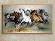 three horses running in the wind on a wall above a painting with white and brown paint