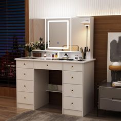 a bathroom vanity with lighted mirror and drawers