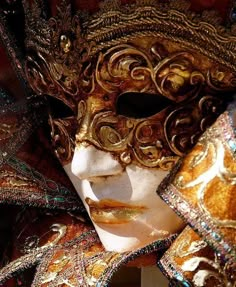 a close up of a person wearing a mask