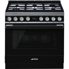 a black stove top oven with four burners and two griddles on the front