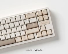 a computer keyboard sitting on top of a white table