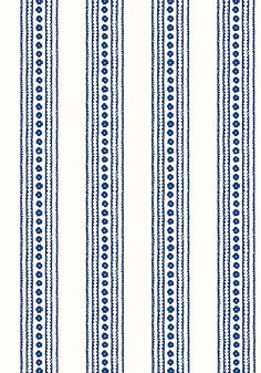 a blue and white striped wallpaper with small circles on the top of each stripe