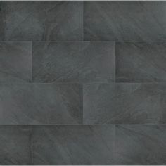 an image of a tile wall that looks like it is made out of dark grey marble