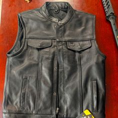 Brand New Never Worn Never Tried On New With Tags Street & Steel Brand Concealed Carry Pockets On Both Sides, Black Leather Biker Vest. Redwood/Cali Style Model, Pretty Closely Resembles What Jax From Sons Of Anarchy Wore The Entire Series. With The Short Collar And Buttons And Zippers. Msrp Is $170 #Soa #Biker #Bikervest #Leather #Ridingvest #Moto #Motorcycles Fitted Leather Jacket With Pockets For Biker Events, Moto Style Vest For Biker Events In Fall, Moto Vest For Biker Events In Fall, Biker Vest For Motorcycling In Fall, Fall Biker Vest For Motorcycling, Classic Fitted Vest For Biker Events, Classic Biker Jacket With Pockets For Biker Events, Fitted Biker Outerwear With Snap Buttons, Fitted Biker Vest For Fall