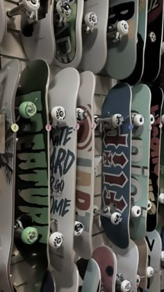 many skateboards are lined up on the wall and ready to be used for display