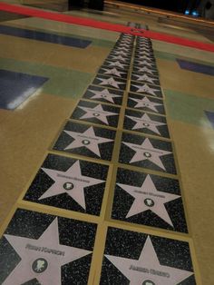 the star on the hollywood walk of fame has been decorated with white and black stars