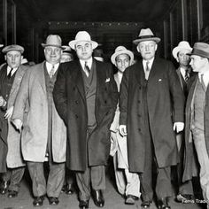 black and white photograph of men in suits and hats