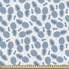 blue pineapples on white background with polka dot pattern in the center and dots at the bottom