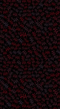 an abstract background with red and purple letters on black paper, which are all over the place