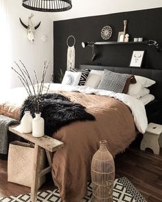 a bedroom with black and white decor on the walls