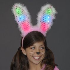 Light Up Bunny Ears Headband Pink and White are a fun and playful item for all ages to enjoy. They're especially great for Easter and Halloween! Be a cute bunny or a light up rabbit. To activate them, simply turn the switch located on the back of the head band to the ON position. One size fits most. Make any ordinary night into an extraordinary night! NOTE: The Light Up Bunny Ears are bendable, but do not bend on their own. Dimensions: Height: Approx.10.25 in. Width: Approx.9.5 in. LED Colors: 2 Fun Pink Adjustable Costume Accessories, Cute Adjustable Headband Costume Accessories, Cute Halloween Party Headband, Playful Adjustable Ears Headband, Novelty Bunny Ears For Party Costume Accessories, Novelty Bunny Ears Costume Accessories For Party, Fun Multicolor Headband For Gift, Fun Multicolor Headband For Gifts, Fun Multicolor Headband As Gift