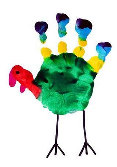 a hand made to look like a bird with different colored feathers on it's head