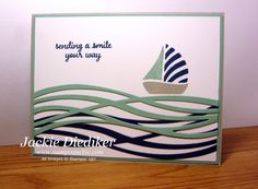 a close up of a card with a sailboat on the water and words saying sending a smile your way