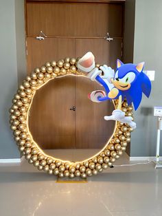 an image of a mirror with sonic the hedgehog on it and gold balls around it