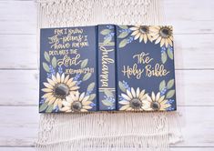 two blue books with sunflowers on them