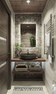 a bathroom with a sink, mirror and towel rack on the wall next to it