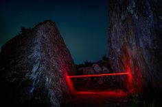 a red light in between two large rocks