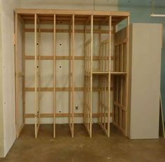 an empty room with unfinished shelves in it