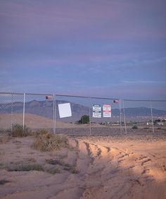 there is a sign on the fence that says don't enter this area,