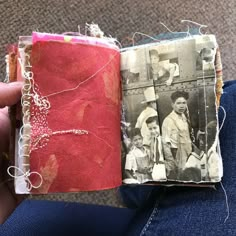 an old photo is being stitched into a book with twine and thread on it