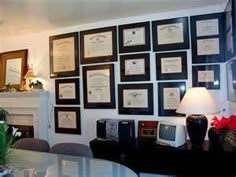 there are many framed pictures on the wall