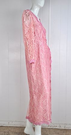 "A darling pink lace dress by JC Penney circa the 60s / 70s. It has little snaps at the sleeves, nape, and bust. There's a back zipper closure with a natural opening in the lace fabric to allow for the zipper to move. Made in the USA. Would suit a small or petite medium, but please see measurements below for accurate fit. CONDITION: Great gently worn condition. No flaws to note. MEASUREMENTS Bust: 38\" Waist: 30\" Length: 51\" Have a question? Please ask me anything." Pink Scalloped Lace Dress For Bridesmaids, Pink Lace Formal Dress, Pink Scalloped Lace Bridesmaid Dress, Pink Bridesmaid Lace Dress With Scalloped Lace, Pink Long Sleeve Lace Dress With Lace Patchwork, Pink Long Sleeve Lace Dress For Evening, Pink Fitted Lace Dress With Lace Sleeves, Fitted Pink Lace Dress With Lace Sleeves, Formal Pink Long Sleeve Lace Dress