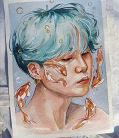 a watercolor painting of a woman with blue hair and gold fish on her face