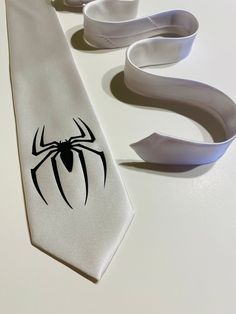 "High quality necktie. Great material. Very durable. 3.2'' at the widest point, 58\" long from tip to tip. Adult necktie. If you need something added or changed feel free to message me. Custom designs are welcome, I will do my best to make it on a tie, no set up free for custom graphic. You pay only if you approve the final look on the tie. I try to ship the next business with USPS First Class Shipping which takes 3-5 days to arrive. If you order more then 3 ties I will ship Priority Mail 2-3 da Men’s Tie, White Ties For Black Tie Events On Father's Day, White Tie For Black Tie Events, Silver Ties For Father's Day Gift, Silver Ties For Weddings And Father's Day, Classic White Suit And Tie Accessories For Gift, Silver Wedding Tie, White Standard Tie For Suit As A Gift, White Adjustable Suit And Tie Accessories For Wedding