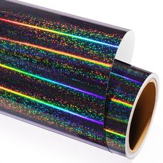 a roll of black and multicolored glitter wrapping paper