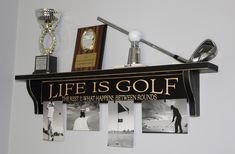 a shelf with golf memorabilia and trophies on it