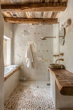 a bathroom with a wooden bench and white walls