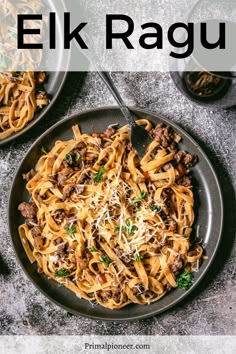 a plate of pasta with meat and parmesan cheese on top, next to two bowls of other food