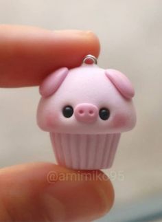 a tiny pink cupcake shaped animal charm