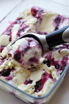 a scoop of ice cream in a glass dish with the words keep calm and make blueberry cheesecake ice cream